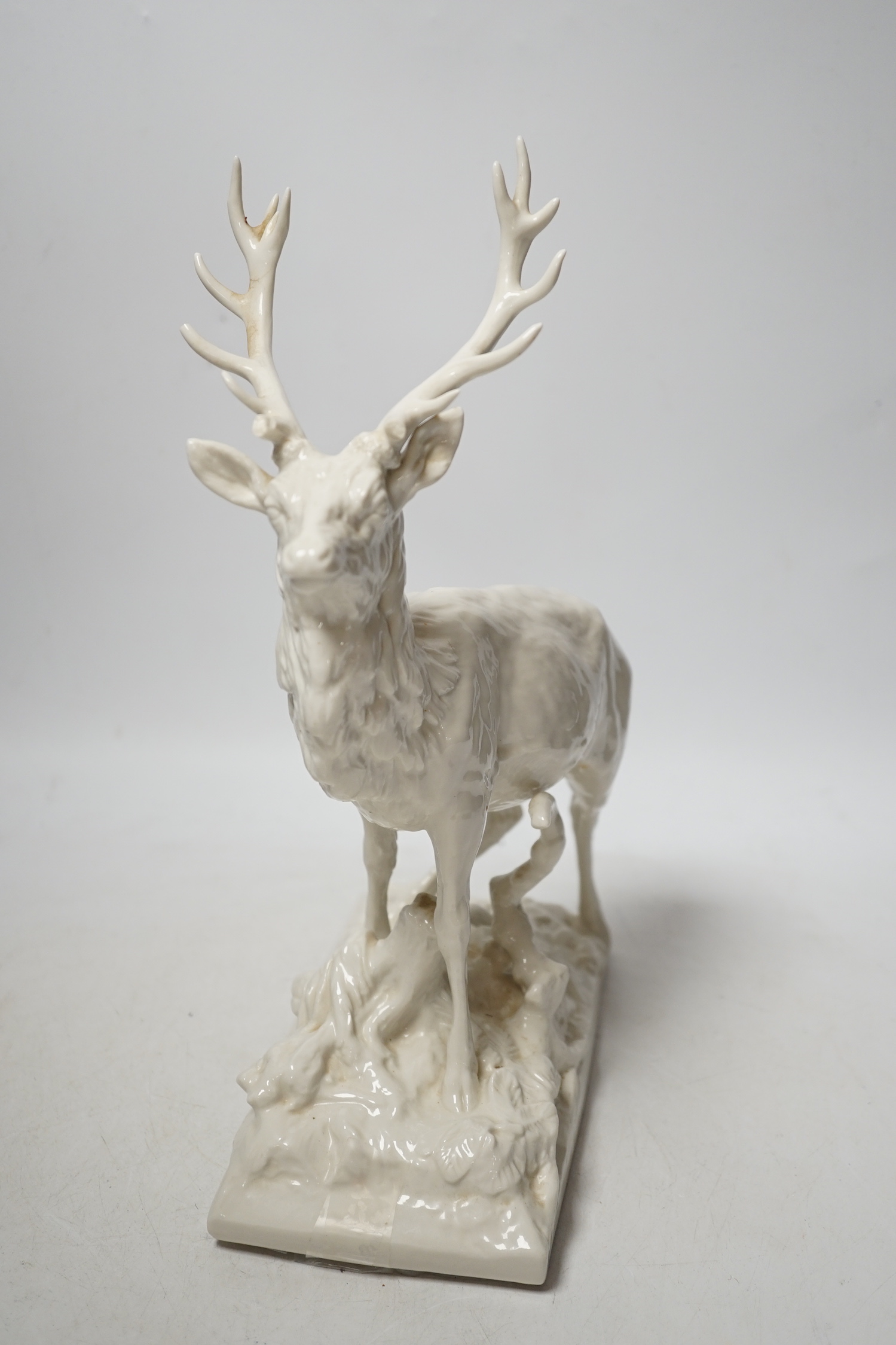 A Nymphenburg white glazed porcelain model of a stag, 31cm high